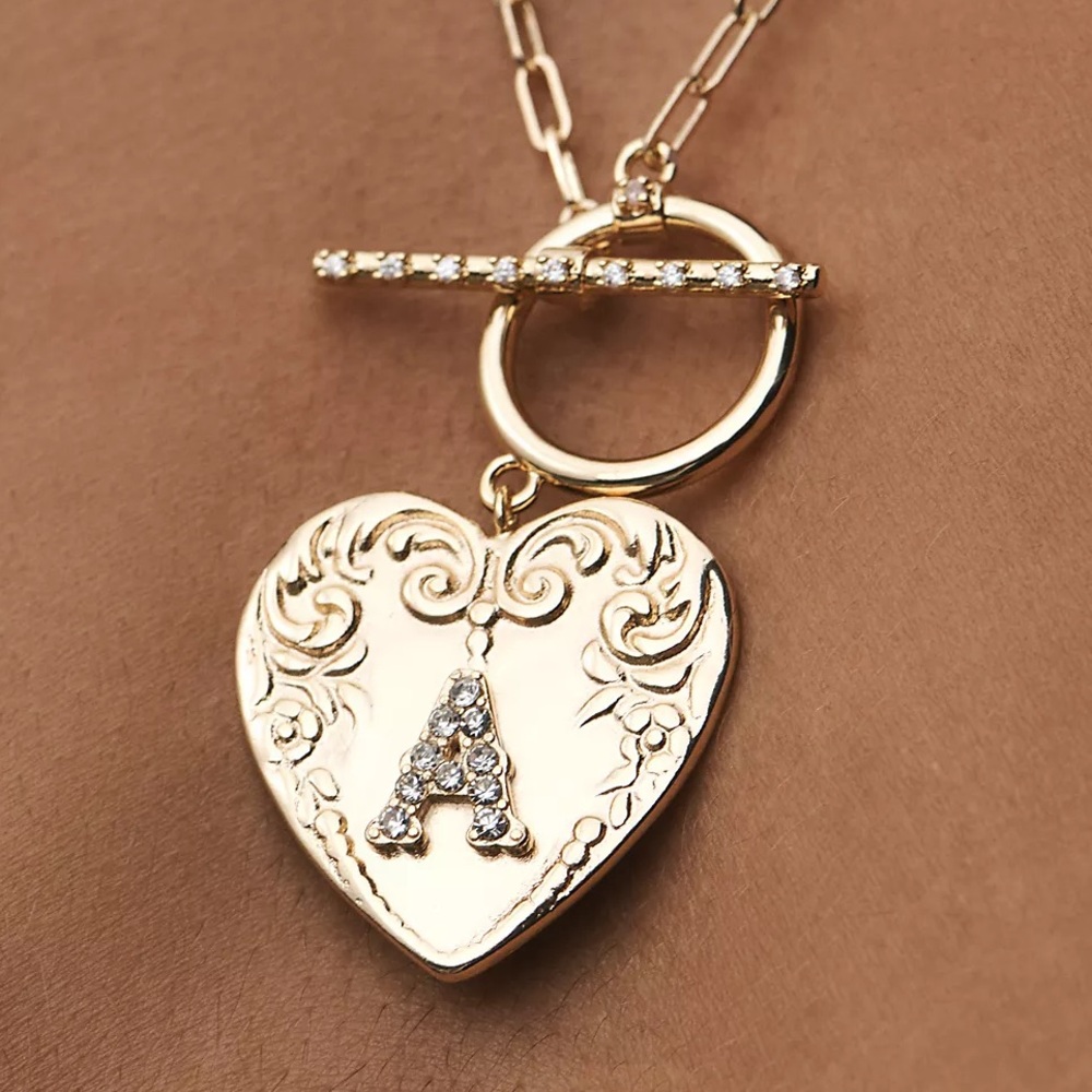 Anthropologie gold M Monogram Heart Toggle Necklace